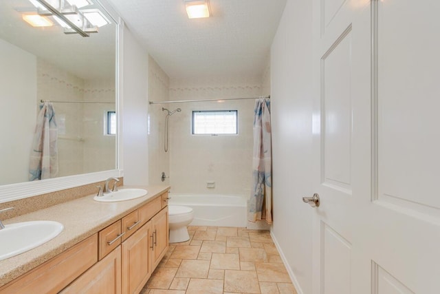 full bathroom with shower / bath combination with curtain, toilet, a textured ceiling, and vanity