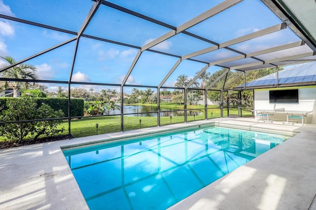 view of swimming pool featuring a lanai, a patio area, and a yard