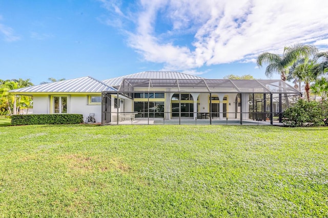 back of house featuring a lanai, a yard, and a swimming pool