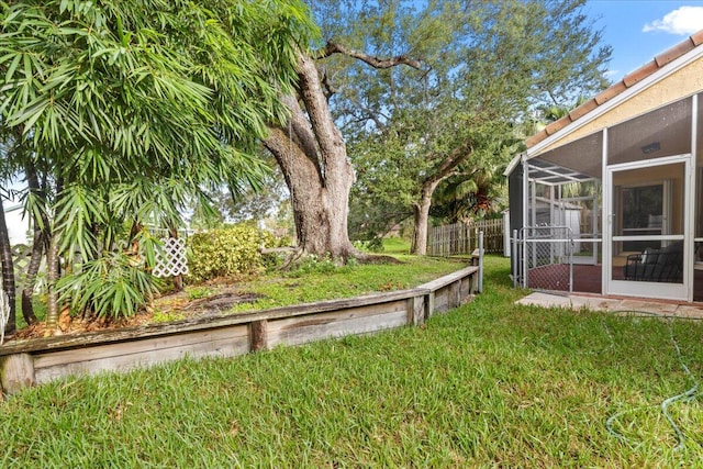 view of yard with a sunroom