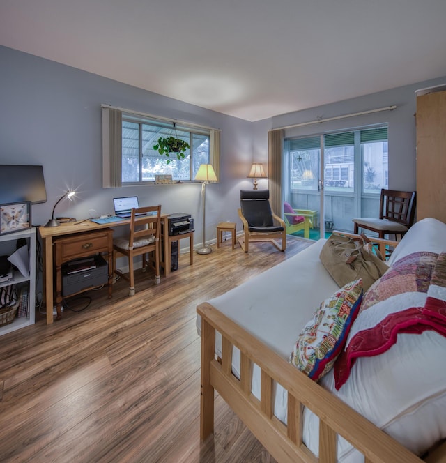 living room featuring plenty of natural light and hardwood / wood-style floors