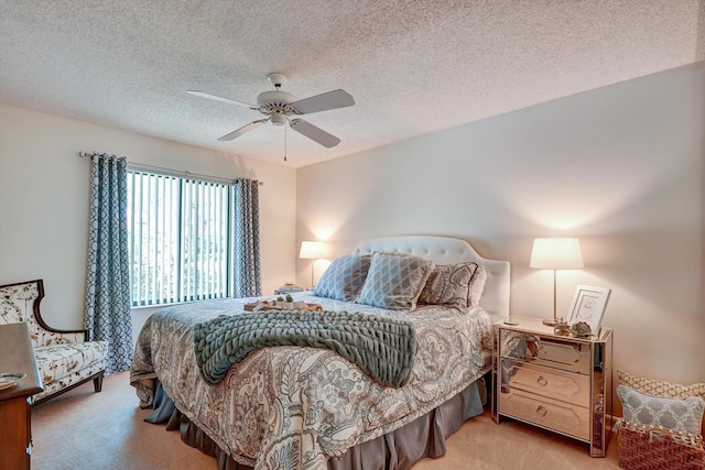 bedroom with a textured ceiling, light carpet, and ceiling fan