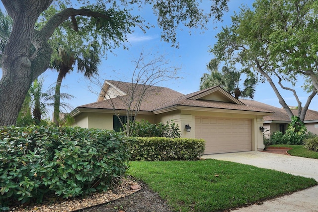 ranch-style home with a garage and a front yard