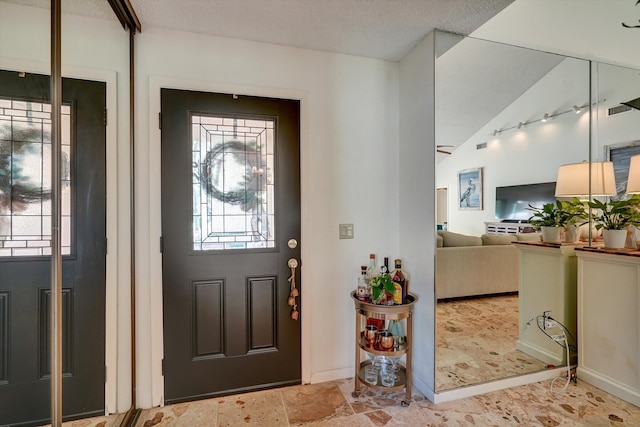 entrance foyer with a textured ceiling