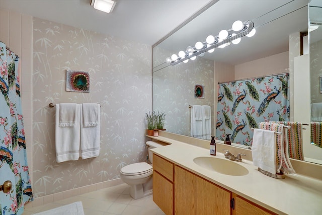 bathroom featuring toilet, vanity, and tile patterned floors