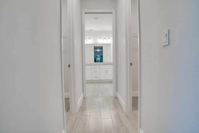 corridor featuring light hardwood / wood-style flooring