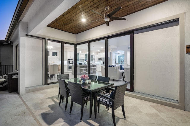 view of patio featuring ceiling fan