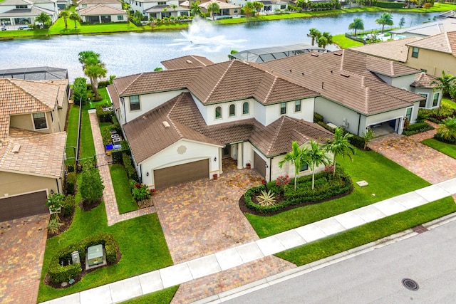 birds eye view of property with a water view