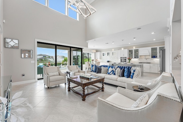 110 Echelon Crest Trl, Jupiter, FL 33478 - living area featuring a high ceiling, a chandelier, and recessed lighting