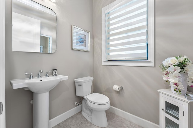 bathroom with toilet and beverage cooler