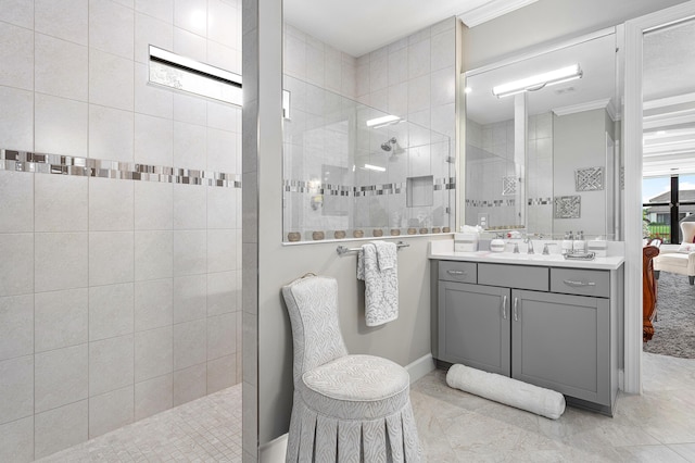 bathroom featuring vanity, tile patterned floors, walk in shower, and crown molding