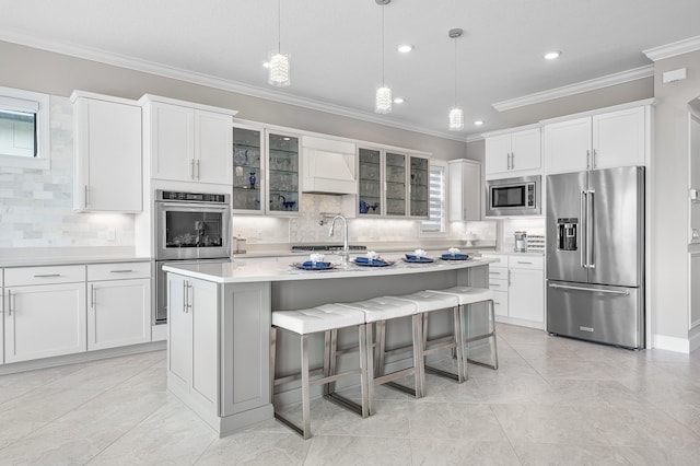 110 Echelon Crest Trl, Jupiter, FL 33478 - kitchen featuring stainless steel appliances, backsplash, ornamental molding, light countertops, and glass insert cabinets