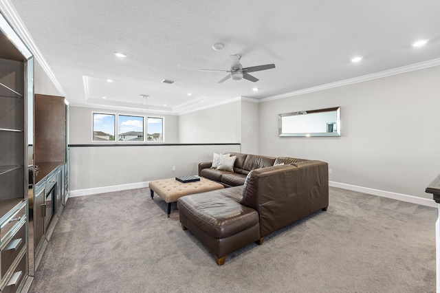110 Echelon Crest Trl, Jupiter, FL 33478 - carpeted living area featuring a ceiling fan, recessed lighting, ornamental molding, and a tray ceiling