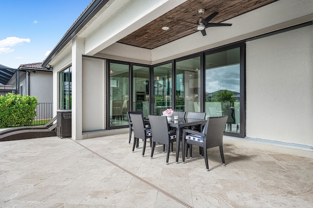 view of patio featuring ceiling fan