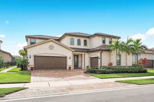 110 Echelon Crest Trl, Jupiter, FL 33478 - mediterranean / spanish house with decorative driveway, stucco siding, a garage, and a tiled roof