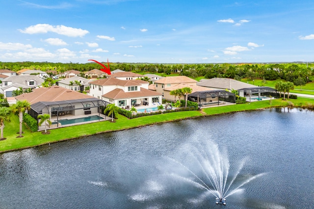 birds eye view of property with a water view