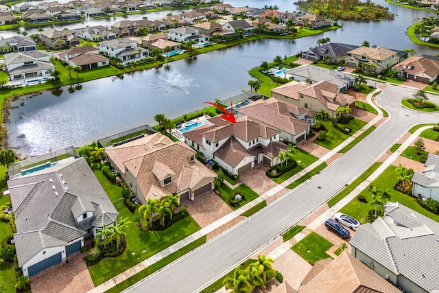 birds eye view of property featuring a water view