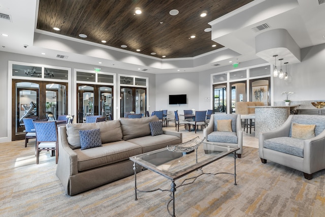 living room featuring a chandelier, french doors, a raised ceiling, and wood ceiling