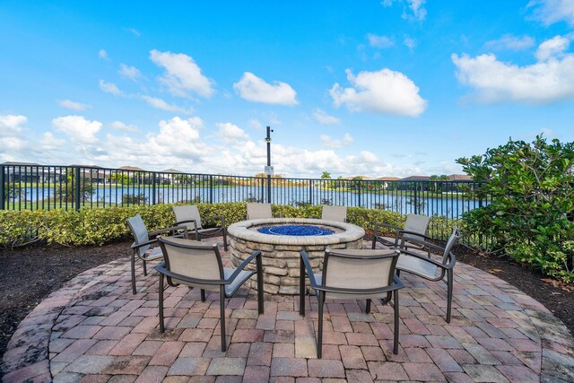 110 Echelon Crest Trl, Jupiter, FL 33478 - view of patio / terrace with a fire pit and a water view