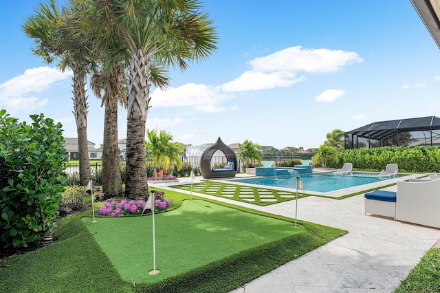 110 Echelon Crest Trl, Jupiter, FL 33478 - view of swimming pool featuring a putting green, a patio area, a fenced backyard, and a pool with connected hot tub