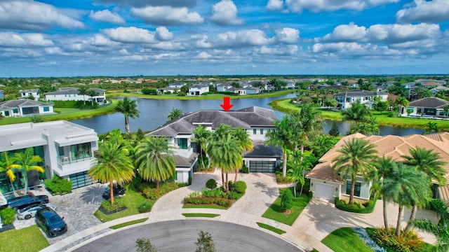 birds eye view of property with a water view