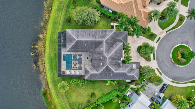 birds eye view of property with a water view