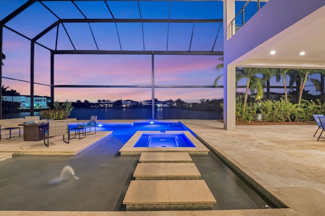 pool at dusk with a water view