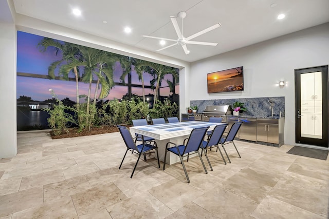 view of patio featuring an outdoor kitchen, ceiling fan, and a grill