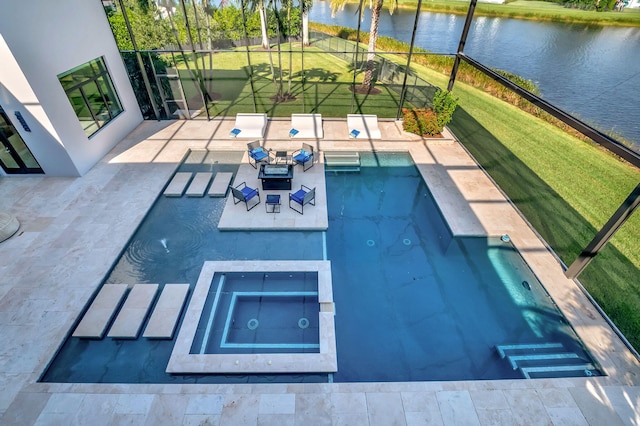 view of pool with a patio, a water view, an in ground hot tub, and a yard