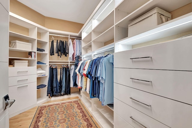 spacious closet featuring light hardwood / wood-style floors