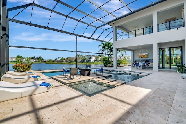 view of swimming pool with a lanai, a water view, an in ground hot tub, and a patio area