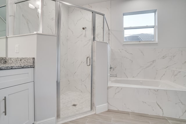 bathroom with vanity and plus walk in shower