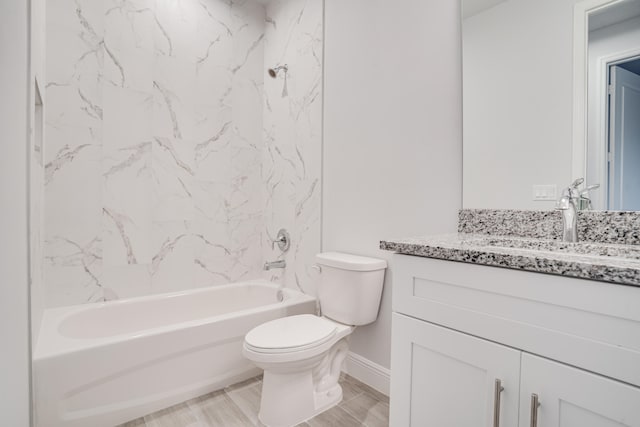 full bathroom with vanity, tiled shower / bath combo, and toilet