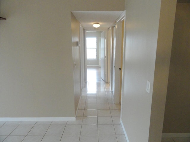 hallway with light tile patterned flooring