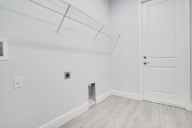 laundry room with light wood-type flooring and electric dryer hookup