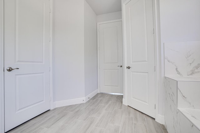 corridor featuring light wood-type flooring