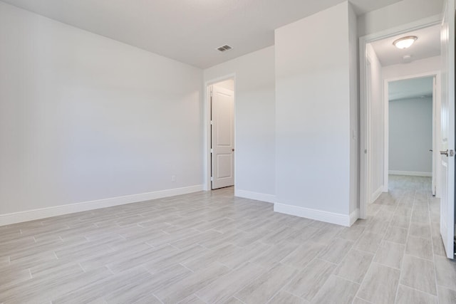 unfurnished room featuring light hardwood / wood-style flooring