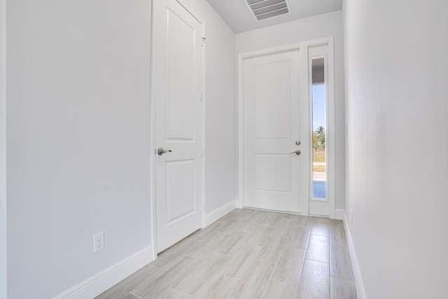 foyer entrance with light wood-type flooring