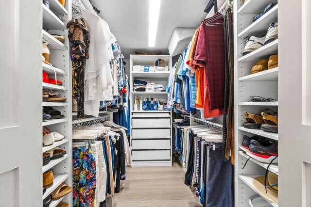 spacious closet with light wood-type flooring