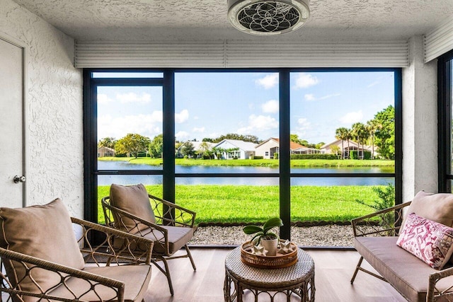 12871 Briarlake Dr Unit 102, Palm Beach Gardens, FL 33418 - sunroom / solarium featuring a water view, plenty of natural light, and a residential view
