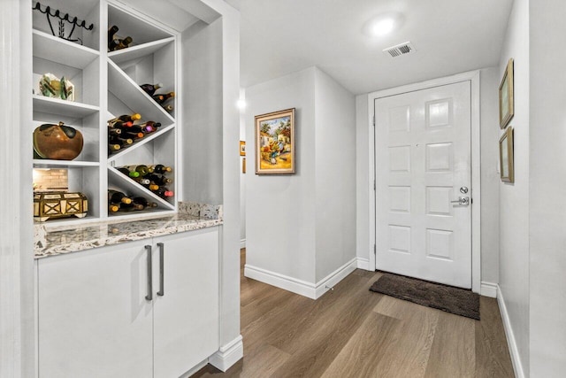 12871 Briarlake Dr Unit 102, Palm Beach Gardens, FL 33418 - wine cellar featuring baseboards and dark wood-style flooring