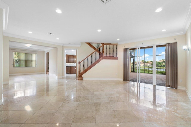 spare room with crown molding