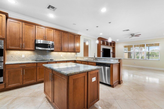 kitchen with crown molding, ceiling fan, pendant lighting, and stainless steel appliances