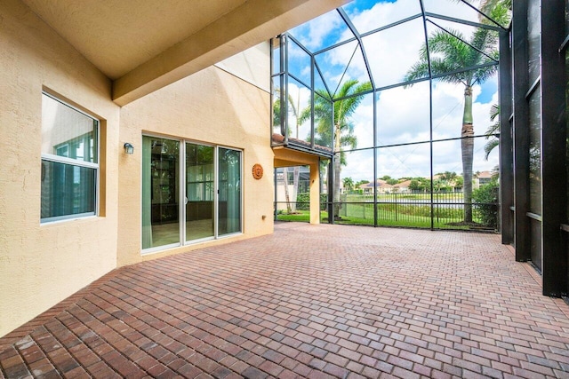 view of patio / terrace featuring glass enclosure