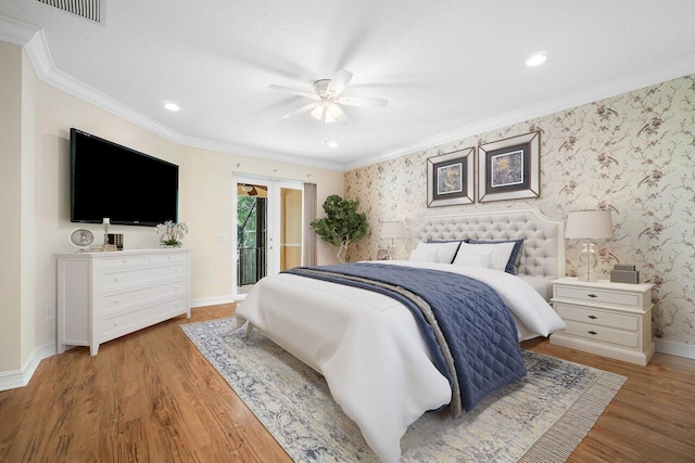 bedroom with hardwood / wood-style floors, ceiling fan, a textured ceiling, and access to outside