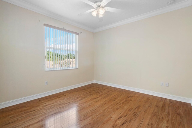 empty room with crown molding, ceiling fan, and wood-type flooring