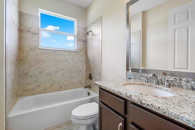 full bathroom with tile patterned floors, vanity, toilet, and tiled shower / bath