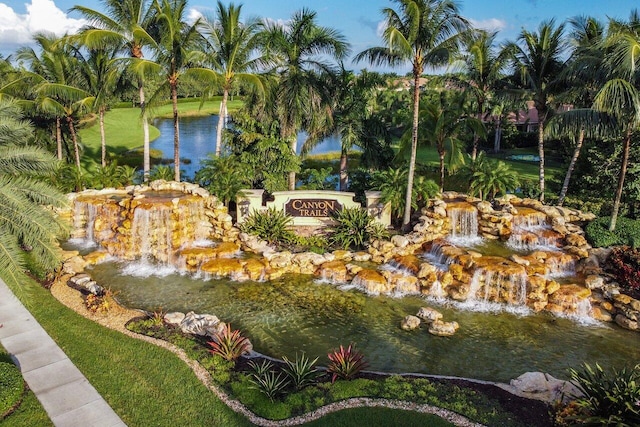 exterior space featuring a garden pond