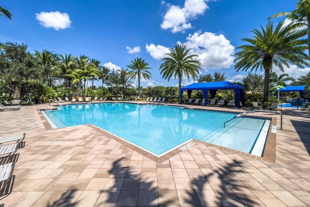 view of swimming pool featuring a patio area