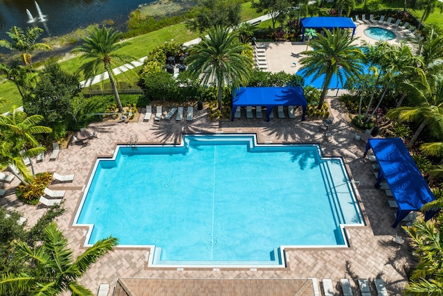 view of swimming pool with a water view